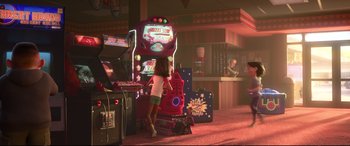 Movie still from “Ralph Breaks the Internet” (2018), directed by Rich Moore – A little girl standing in front of a video game machine; Wide shot, Over the shoulder angle