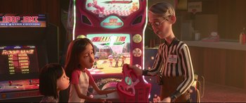 Movie still from “Ralph Breaks the Internet” (2018), directed by Rich Moore – A woman and a little girl are playing a game; Medium shot, Over the shoulder angle
