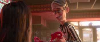 Movie still from “Ralph Breaks the Internet” (2018), directed by Rich Moore – An old man holding a pair of red plastic scissors; Medium shot, Over the shoulder angle