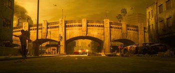 Movie still from “Ralph Breaks the Internet” (2018), directed by Rich Moore – A car driving under an overpass at night; Extreme Wide shot, Low angle
