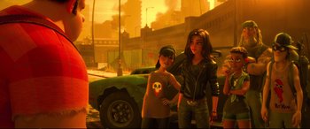 Movie still from “Ralph Breaks the Internet” (2018), directed by Rich Moore – Two young women standing next to a car in an urban setting; Medium shot, Over the shoulder angle