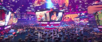 Movie still from “Ralph Breaks the Internet” (2018), directed by Rich Moore – An audience is sitting in front of a large screen; Extreme Wide shot, Over the shoulder angle