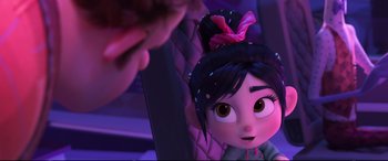 Movie still from “Ralph Breaks the Internet” (2018), directed by Rich Moore – A woman is looking at a mirror in a room; Close Up shot, Over the shoulder angle