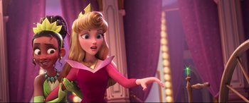 Movie still from “Ralph Breaks the Internet” (2018), directed by Rich Moore – A woman in a pink dress and a crown is holding out her hand; Medium shot, Over the shoulder angle