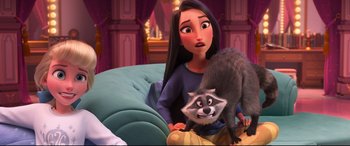 Movie still from “Ralph Breaks the Internet” (2018), directed by Rich Moore – A woman sitting on a couch with a racoon on her lap; Medium shot, Over the shoulder angle