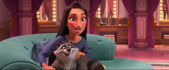 Movie still from “Ralph Breaks the Internet” (2018), directed by Rich Moore – A woman sitting on a couch with a dog; Medium shot, Over the shoulder angle