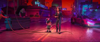 Movie still from “Ralph Breaks the Internet” (2018), directed by Rich Moore – A woman and a child are standing on a fire hose; Wide shot, High angle
