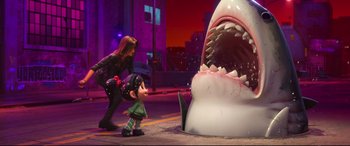 Movie still from “Ralph Breaks the Internet” (2018), directed by Rich Moore – A woman and a small child in front of an animated shark; Wide shot, Over the shoulder angle