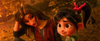 Movie still from “Ralph Breaks the Internet” (2018), directed by Rich Moore – A woman and a girl are posing for a picture; Close Up shot, Over the shoulder angle