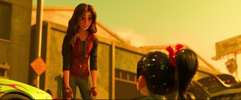 Movie still from “Ralph Breaks the Internet” (2018), directed by Rich Moore – A woman standing in front of a boy in front of a building; Medium shot, Over the shoulder angle