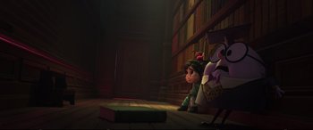 Movie still from “Ralph Breaks the Internet” (2018), directed by Rich Moore – A little girl sitting in front of a book case; Wide shot, Over the shoulder angle