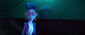 Movie still from “Ralph Breaks the Internet” (2018), directed by Rich Moore – A woman with blue hair wearing glasses and a blue jacket; Close Up shot, Over the shoulder angle