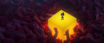 Movie still from “Ralph Breaks the Internet” (2018), directed by Rich Moore – A small cartoon character standing on top of a yellow cube; Extreme Wide shot, High angle