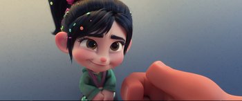 Movie still from “Ralph Breaks the Internet” (2018), directed by Rich Moore – A cartoon character's face and hand; Close Up shot, Over the shoulder angle