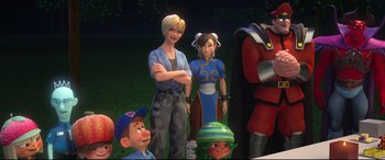 Movie still from “Ralph Breaks the Internet” (2018), directed by Rich Moore – A group of people standing next to each other in the grass; Medium shot, Over the shoulder angle