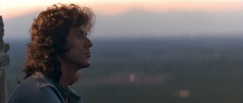 Movie still from “Rambo III” (1988), directed by Peter MacDonald – A person looking at the sky; Close Up shot, Low angle