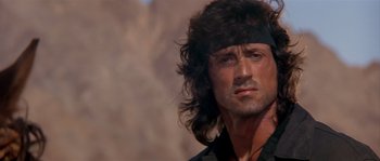 Movie still from “Rambo III” (1988), directed by Peter MacDonald – Sylvester stallone as rambo; Close Up shot, Low angle