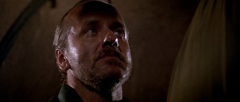 Movie still from “Rambo III” (1988), directed by Peter MacDonald – A person with a beard; Close Up shot, Low angle