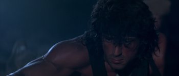 Movie still from “Rambo III” (1988), directed by Peter MacDonald – Sylvester stallone as rambo; Close Up shot, Low angle