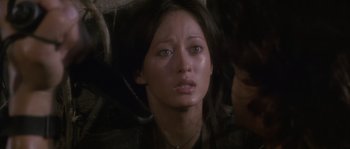 Movie still from “Rambo: First Blood Part II” (1985), directed by George P. Cosmatos – A person with a crying face; Close Up shot, Over the shoulder angle