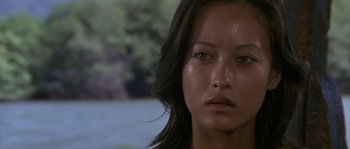 Movie still from “Rambo: First Blood Part II” (1985), directed by George P. Cosmatos – A woman's face in front of a body of water; Close Up shot, Low angle