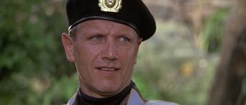 Movie still from “Rambo: First Blood Part II” (1985), directed by George P. Cosmatos – A person wearing a hat; Close Up shot, Low angle