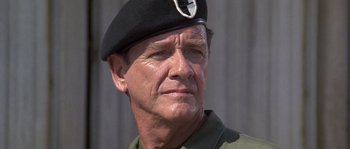 Movie still from “Rambo: First Blood Part II” (1985), directed by George P. Cosmatos – A person wearing a hat; Close Up shot, Low angle