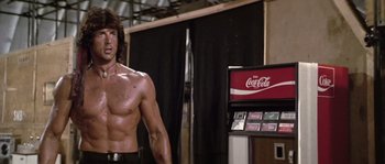 Movie still from “Rambo: First Blood Part II” (1985), directed by George P. Cosmatos – Medium shot, Low angle