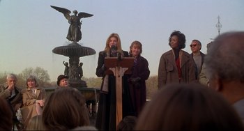 Movie still from “Ransom” (1996), directed by Ron Howard – A group of women standing next to each other on a stage; Medium shot, Low angle