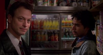 Movie still from “Ransom” (1996), directed by Ron Howard – Two men standing next to each other in front of a refrigerator; Close Up shot, Over the shoulder angle