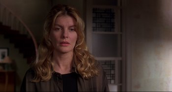 Movie still from “Ransom” (1996), directed by Ron Howard – A person with long blonde hair; Close Up shot, Over the shoulder angle