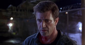 Movie still from “Ransom” (1996), directed by Ron Howard – A person with blood on his face; Close Up shot, Over the shoulder angle
