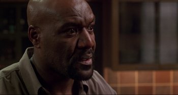 Movie still from “Ransom” (1996), directed by Ron Howard – A person with a beard; Close Up shot, High angle