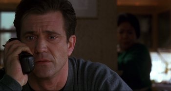 Movie still from “Ransom” (1996), directed by Ron Howard – A person sitting in front of another person; Close Up shot, Over the shoulder angle