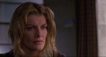 Movie still from “Ransom” (1996), directed by Ron Howard – A person with long blonde hair; Close Up shot, Over the shoulder angle