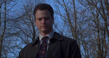 Movie still from “Ransom” (1996), directed by Ron Howard – A person wearing a suit and tie; Close Up shot, Low angle