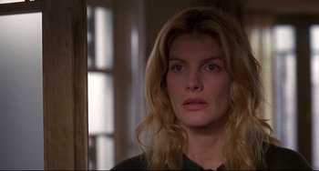 Movie still from “Ransom” (1996), directed by Ron Howard – A person with long blonde hair; Close Up shot, Over the shoulder angle