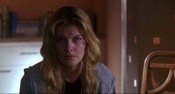Movie still from “Ransom” (1996), directed by Ron Howard – A person with a bruised eye; Close Up shot, Over the shoulder angle