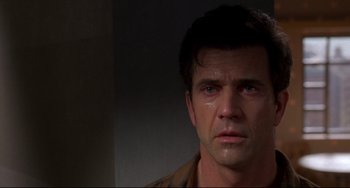 Movie still from “Ransom” (1996), directed by Ron Howard – A person with a crying face; Close Up shot, Over the shoulder angle