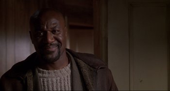 Movie still from “Ransom” (1996), directed by Ron Howard – A person wearing a sweater and a jacket; Close Up shot, Low angle