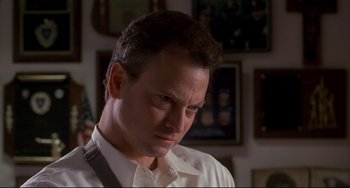 Movie still from “Ransom” (1996), directed by Ron Howard – A person wearing a white shirt and tie; Close Up shot, Low angle