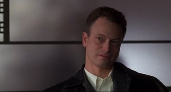 Movie still from “Ransom” (1996), directed by Ron Howard – A person wearing a leather jacket; Close Up shot, Over the shoulder angle