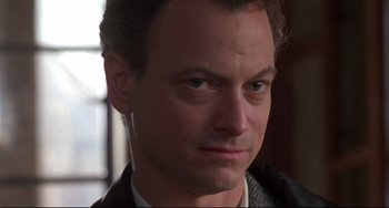 Movie still from “Ransom” (1996), directed by Ron Howard – A man's face in a black jacket; Close Up shot, Low angle