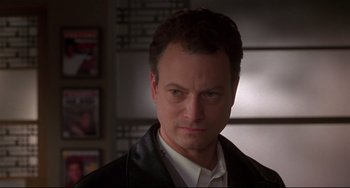 Movie still from “Ransom” (1996), directed by Ron Howard – A person wearing a suit and tie; Close Up shot, Low angle