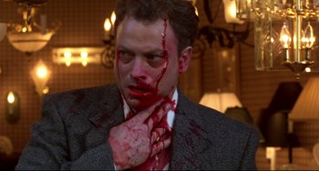 Movie still from “Ransom” (1996), directed by Ron Howard – A man with blood all over his face and neck; Close Up shot, Low angle
