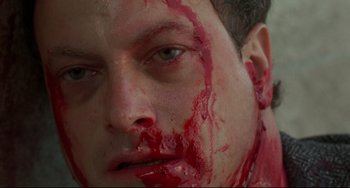 Movie still from “Ransom” (1996), directed by Ron Howard – A person with blood all over his face; Extreme Close Up shot, Overhead angle