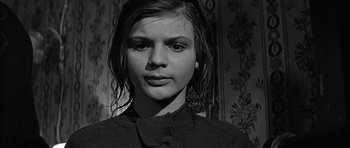 Movie still from “Rapture” (1965), directed by John Guillermin – A young woman with wet hair wearing a black sweater; Close Up shot, Low angle