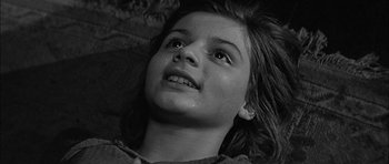 Movie still from “Rapture” (1965), directed by John Guillermin – A young girl with tears in her eyes; Close Up shot, High angle