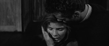 Movie still from “Rapture” (1965), directed by John Guillermin – A man and a woman are crying in a room; Close Up shot, Over the shoulder angle