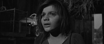 Movie still from “Rapture” (1965), directed by John Guillermin – A young girl with a surprised look on her face; Close Up shot, Low angle